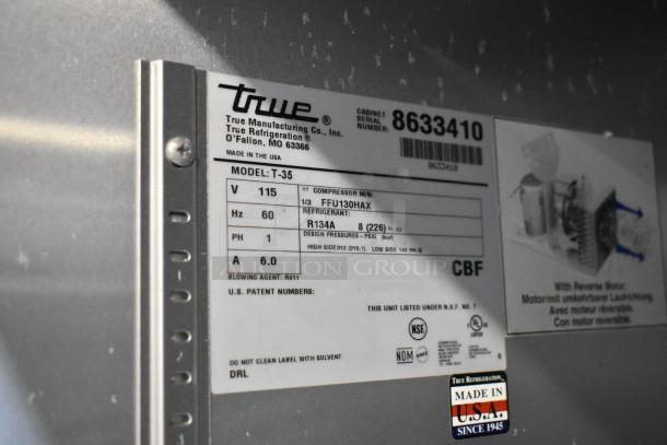 True T-35 cooler label showing model details, 115 volts, 1 phase, made in USA. Tags indicate specs and certifications.