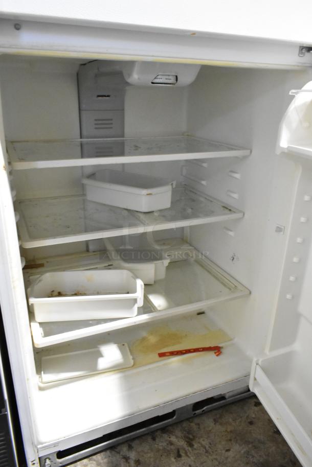 Maytag M1TXEGMYW01 metal cooler with freezer, showing interior shelves and compartments, used condition. 115 volts, 1 phase.