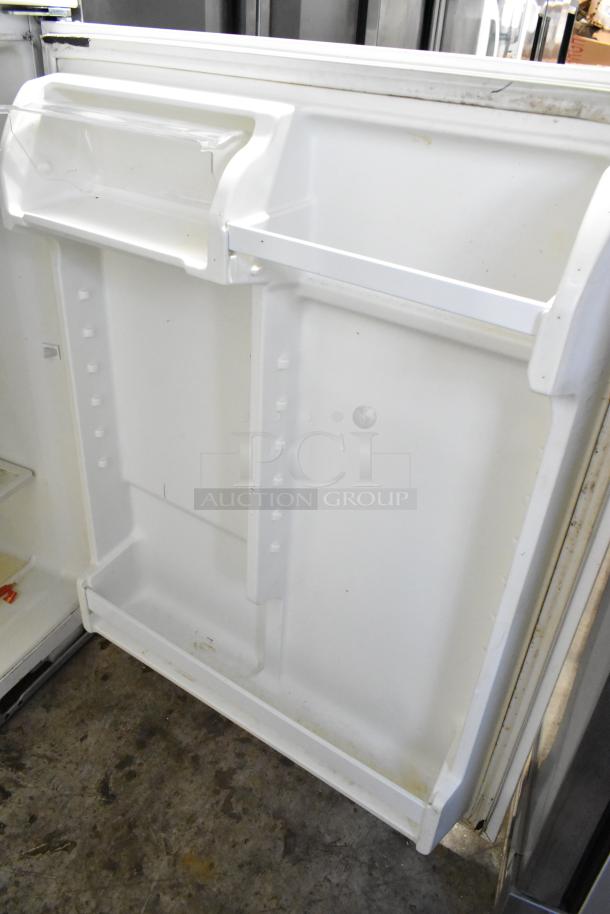 Maytag M1TXEGMYW01 metal cooler with freezer, 115 volts, 1 phase, interior view. Good condition, clean shelves.