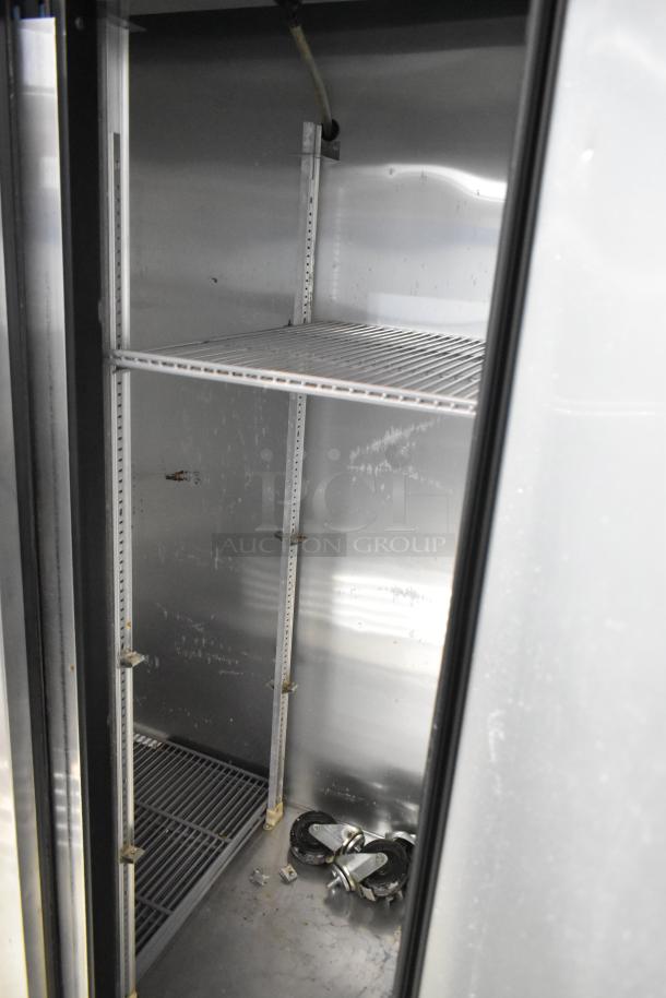 True T-35 stainless steel 2-door reach-in cooler, poly-coated racks, casters shown. 115V, 1 phase. Interior view.