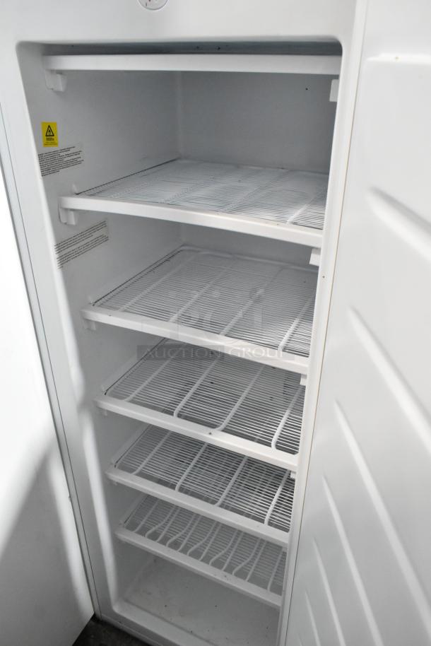Thomson TFRF690 Single Door Freezer, 115V, 1 Phase, white interior with five wire shelves, clean condition.