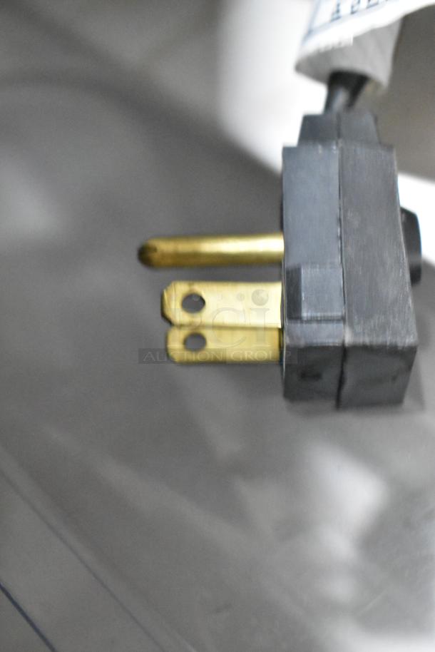 Close-up of the power plug for the 2022 Whirlpool WRT311FZDM02 Stainless Steel Cooler with Freezer. 115 Volts, 1 Phase.