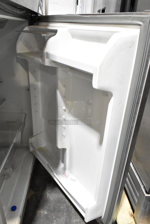 2022 Whirlpool WRT311FZDM02 stainless steel cooler with freezer, interior view, adjustable shelves, good condition.