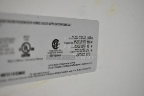Label on 2022 Whirlpool WRT311FZDM02 stainless steel cooler with freezer, showing wattage and energy details.