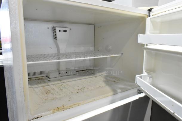 Whirlpool ET1MHKXMQ06 cooler with freezer, showing interior shelves. Condition: used, some visible stains. 115 Volts, 1 Phase.