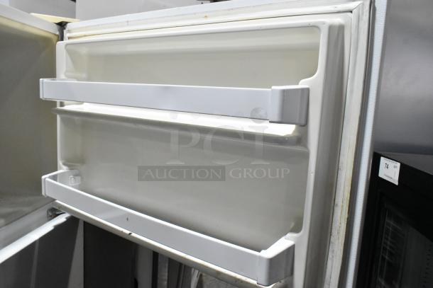 Whirlpool ET1MHKXMQ06 cooler with freezer, 115 volts, 1 phase. Interior view shows door shelves. Good condition.