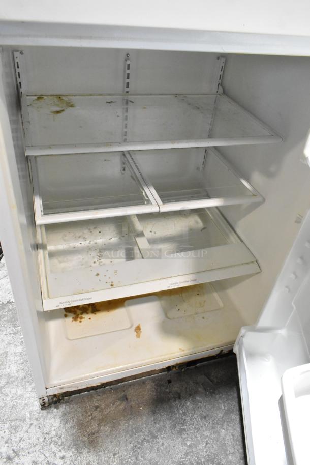 Whirlpool ET1MHKXMQ06 cooler with freezer, 115V, 1 Phase. Interior shows use with stains on shelves and crisper.