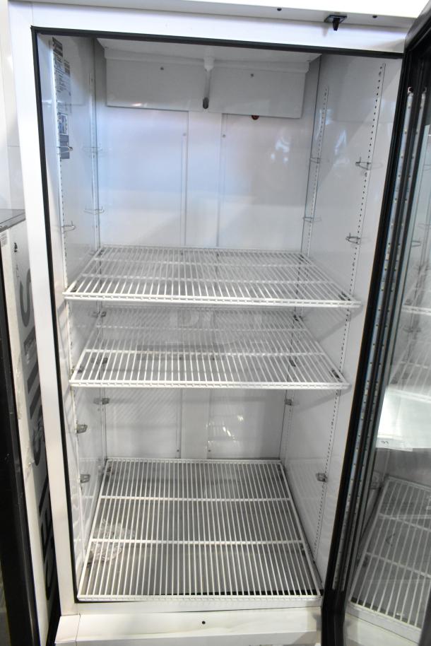 2021 True TSCI-600R-G-PH commercial cooler, single door, poly-coated racks, visible broken glass. 115V, 1 phase.