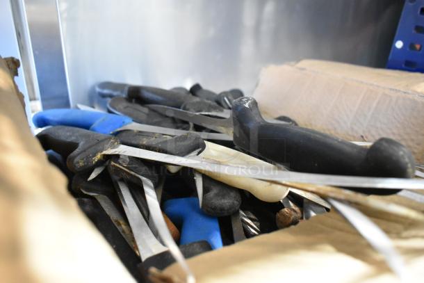 Box of 40 sharpened stainless steel knives, including fillet knife, with mixed handle colors, in good condition.