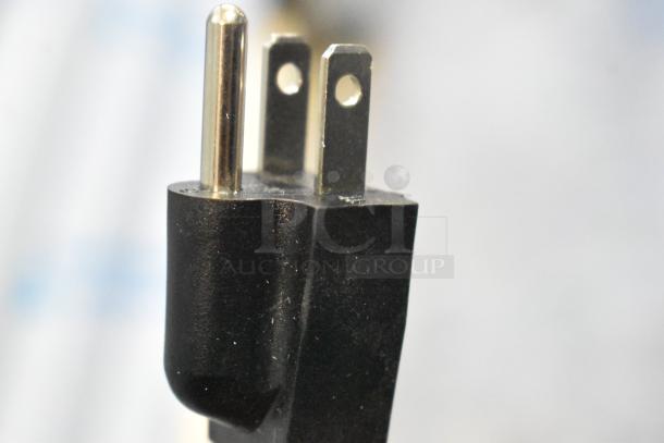 Close-up of a power plug for the AvaMix 928IBHD18 18" Heavy-Duty Immersion Blender, 115 Volts, showing prongs.