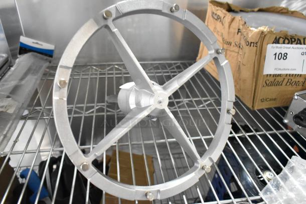 Metal Pelican Head Blade Frame in excellent condition, circular structure with multiple bolts, ideal for industrial use.