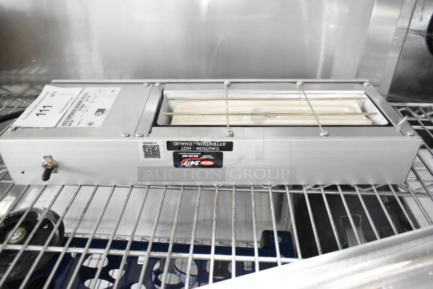 Hatco UGFF metal warming strip, 120 volts, 1 phase, shown on a metal shelf. Caution label and toggle switch visible.