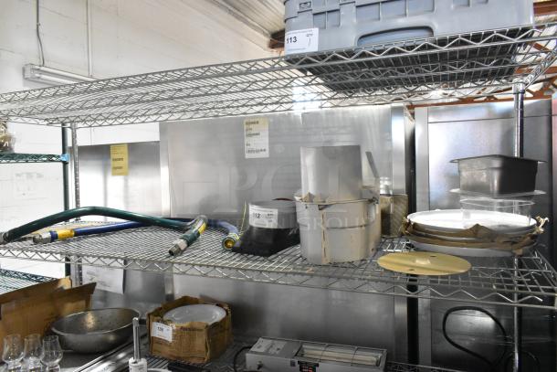 Tiered lot with food processor feed head, Dormont gas hoses, and ceramic plates on metal shelves. Various used items.