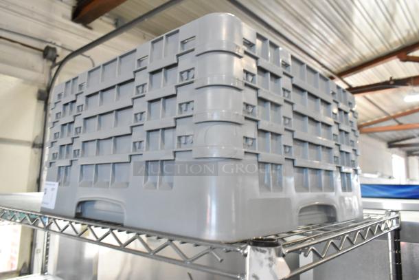 Gray poly dish rack, durable plastic, vented sides, stackable design, excellent condition, ideal for kitchen use.