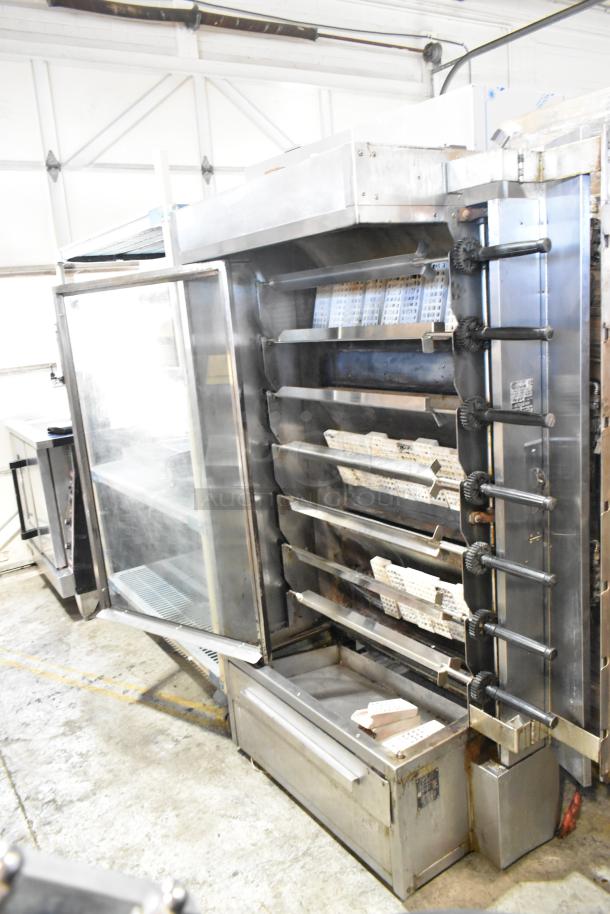 Old Hickory N/7G-RH metal commercial natural gas rotisserie oven with 7 spits, glass door, used condition.