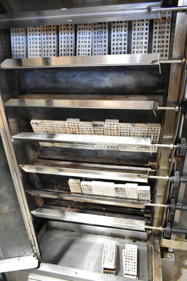 Old Hickory N/7G-RH rotisserie oven with 7 spits, metal construction, natural gas powered. Commercial floor model.