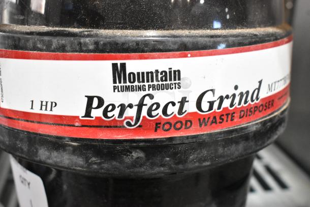 Mountain MT777BFWD batch feed disposer, 1 HP, 115 volts, 1 phase. Labeled "Perfect Grind" by Mountain Plumbing Products.
