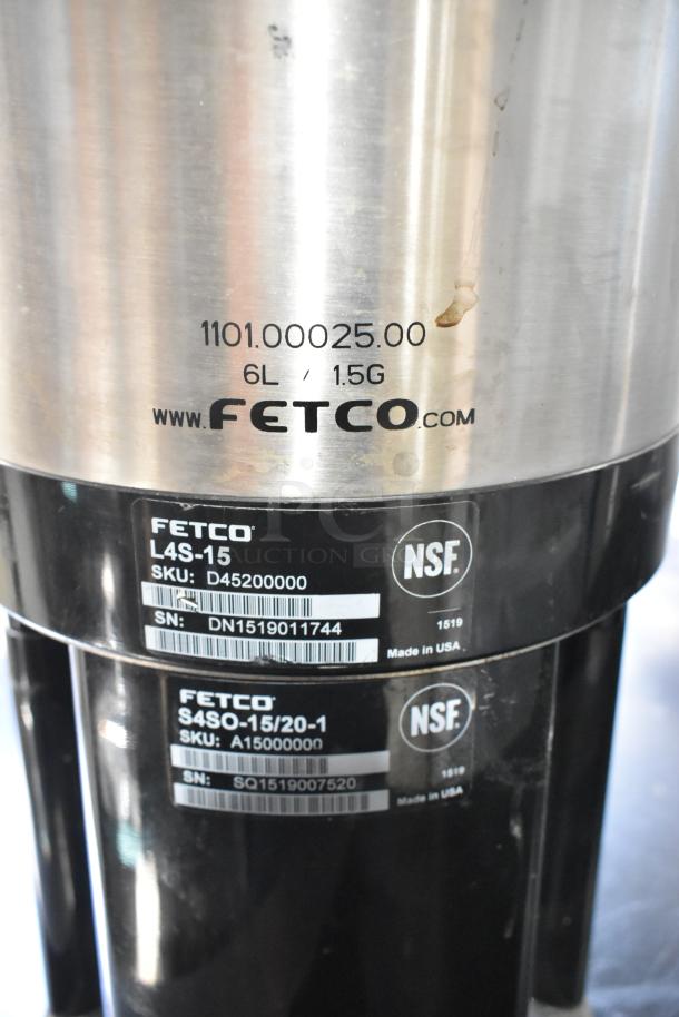 Fetco Luxus L4S-15 stainless steel beverage dispenser, 6L/1.5G capacity, NSF certified, with visible serial and SKU labels.