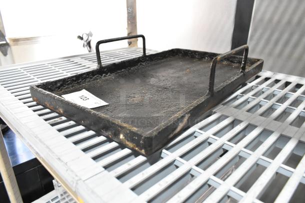 Rugged black metal tray with two handles, appears worn. Auction lot label 123 visible. Suitable for industrial use.