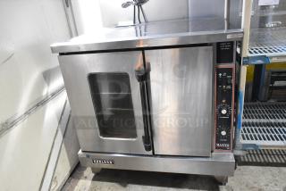 Garland Master 200 stainless steel commercial convection oven with view through door, solid metal oven racks, and thermostatic controls.