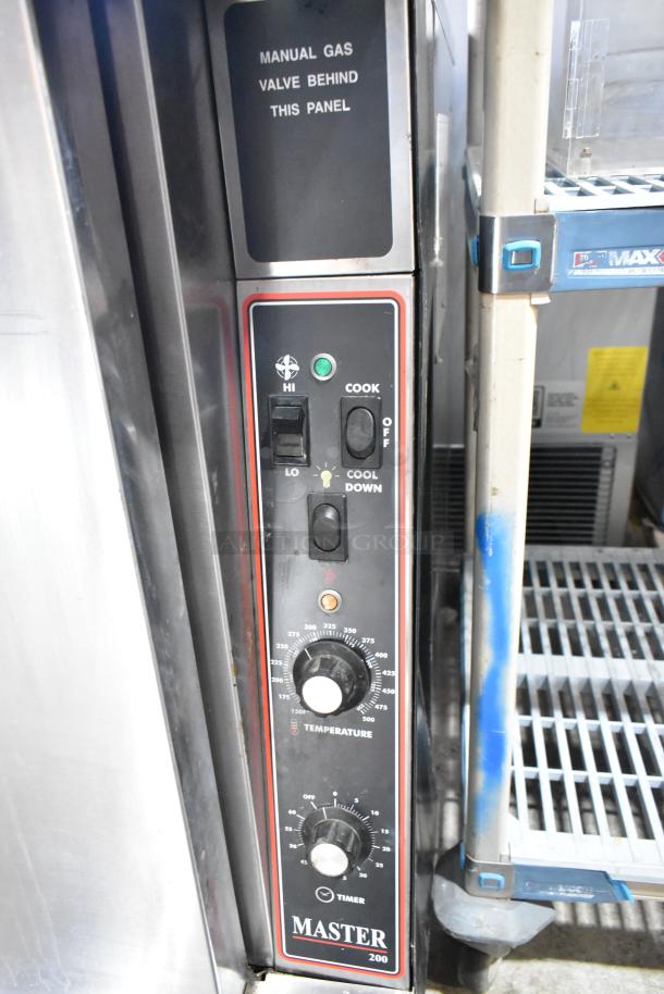 Garland Master 200 stainless steel convection oven with thermostatic controls and manual gas valve panel, used condition.