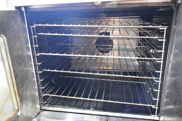 Garland Master 200 stainless steel commercial convection oven interior with metal racks. View-through door, thermostatic controls.