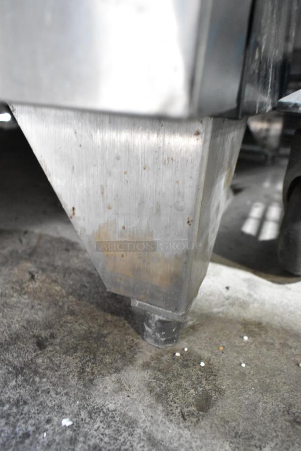 Stainless steel commercial convection oven leg, showing slight wear and rust, part of Garland Master 200 model.