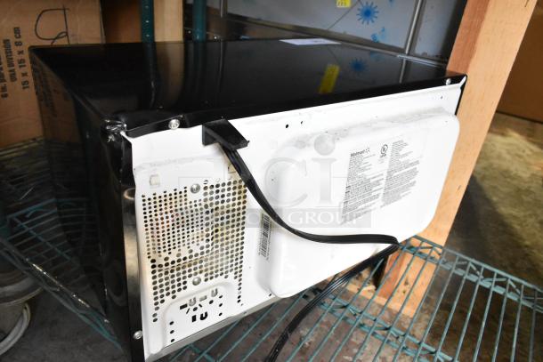 Hamilton Beach P90D23AL-WR1 microwave, black, rear view with power cord. 120 Volts, 1 Phase. Visible condition details.