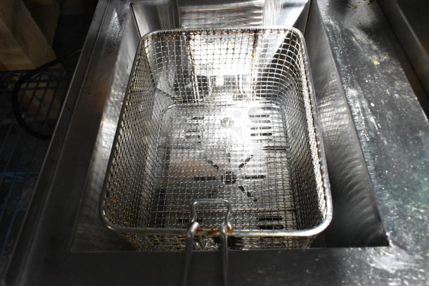 Rovsun EH102V electric deep fryer with metal basket. Two bays, countertop model. Slight wear visible. 110 volts, 1 phase.