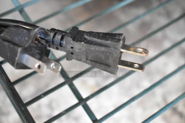 Close-up of a black electrical plug for the Rovsun EH102V 110V countertop fryer.
