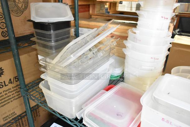 Two-tier shelf with poly bins, cutting boards, and fry baskets. Clear and labeled bins indicate sizes. Used condition.