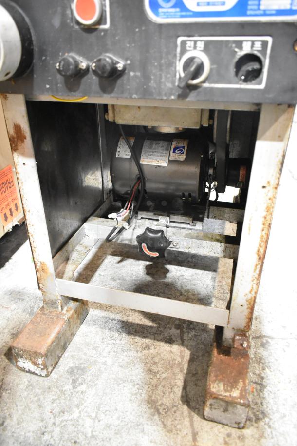 Fujee HFS-350S commercial meat slicer, floor style, 220V. Features rust and wear, visible labels with voltage info.