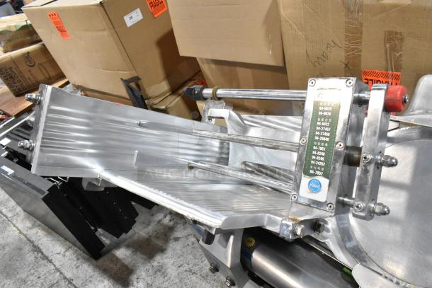 Fujee HFS-350S metal commercial floor meat slicer, 220 volts, shown in used condition, labels visible on machine.