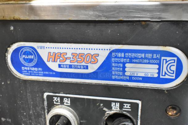 Fujee HFS-350S Metal Meat Slicer label showing model and specifications. 220 volts, 1500W, commercial use.