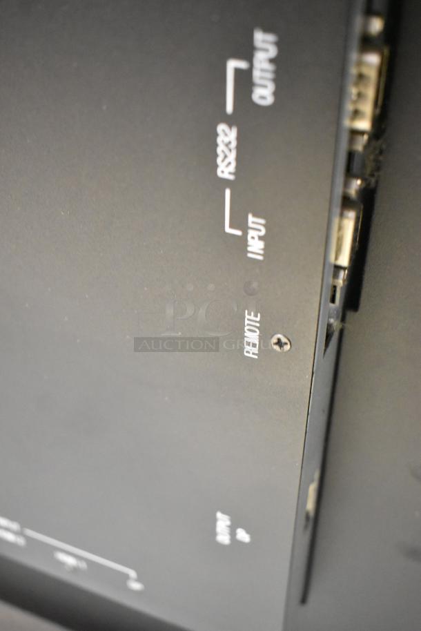 2017 Dongwoo XH100080-14001A monitor, black, 220V, 1 phase, showing RS232 input/output ports and remote connection.