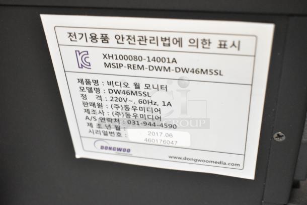 2017 Dongwoo XH100080-14001A Monitor label, 220V, model DW46M5SL, with manufacturer details and contact info.