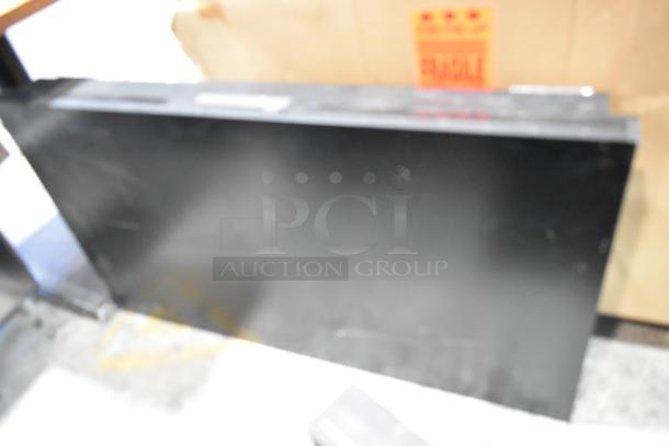 Two 2017 Dongwoo XH100080-14001A monitors, 220V, 1 phase, bidding for 2 units, buyer pick-up only, fragile label visible.