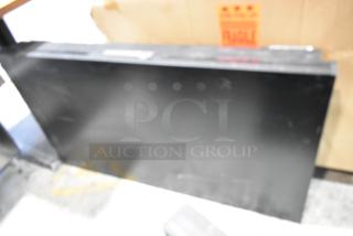 Two 2017 Dongwoo XH100080-14001A monitors, 220V, 1 phase, bidding for 2 units, buyer pick-up only, fragile label visible.