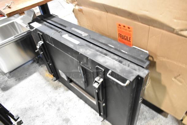 Two 2017 Dongwoo XH100080-14001A monitors, 220 volts, 1 phase. Includes "Fragile" label. Buyer pickup required.