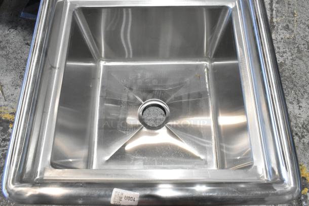 Brand new Steelton 522CS11818N stainless steel single bay sink, no legs, visible scratches, steel construction.