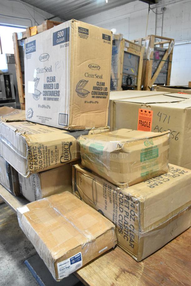 Seven boxes labeled with various packaging brands, including Dart ClearSeal and Choice, contain new plastic containers and cups, some marked as scratch and dent.