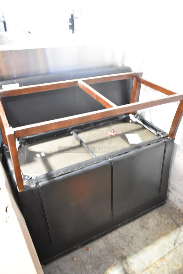 Two black single-sided booth seats with wooden frames, good condition, suitable for restaurant or diner use.