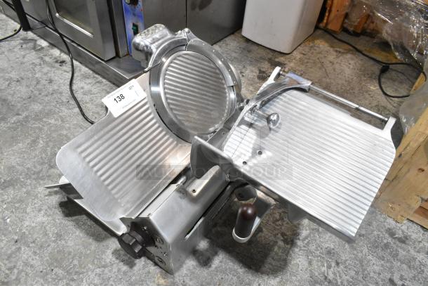 Globe 660 metal commercial countertop meat slicer with blade sharpener, 115 volts, 1 phase, appears in good condition.