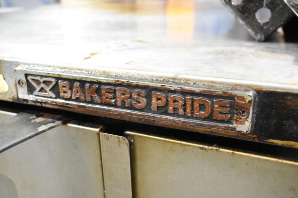 Bakers Pride Cyclone stainless steel commercial convection oven, view-through doors, metal racks, thermostatic controls.