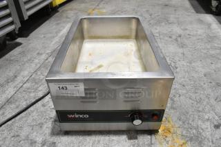 Winco FW-S600 stainless steel commercial food warmer. Electric, 120 volts, 1 phase. Visible wear and use. Auction tag: 143.