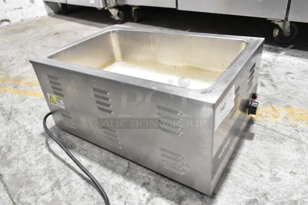 Winco FW-S600 stainless steel food warmer, electric-powered, countertop model in used condition, with visible power cord.