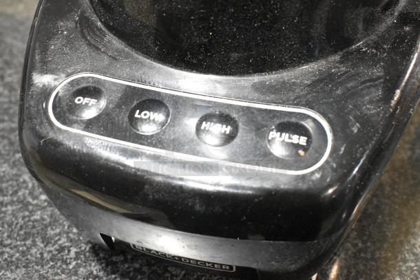 Spectrum FP4200 food processor close-up, showing control buttons for off, low, high, and pulse settings, 120V, 1 phase.