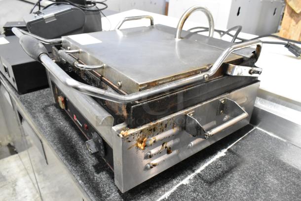 Cecilware 721350 stainless steel commercial countertop panini press, 120 volts, 1 phase. Moderate wear with visible residue.