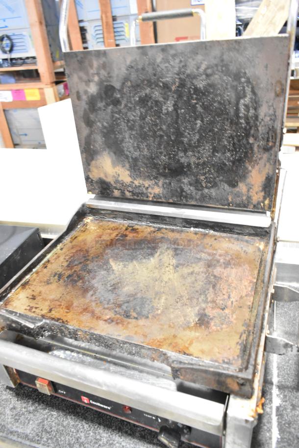 Stainless steel Cecilware 721350 panini press showing visible wear. Features include 120 volts, 1 phase, commercial use.