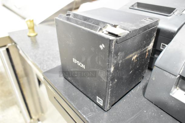 Three black Epson receipt printers and a metal cash drawer. Printers show signs of wear. Model 721350 by Cecilware.